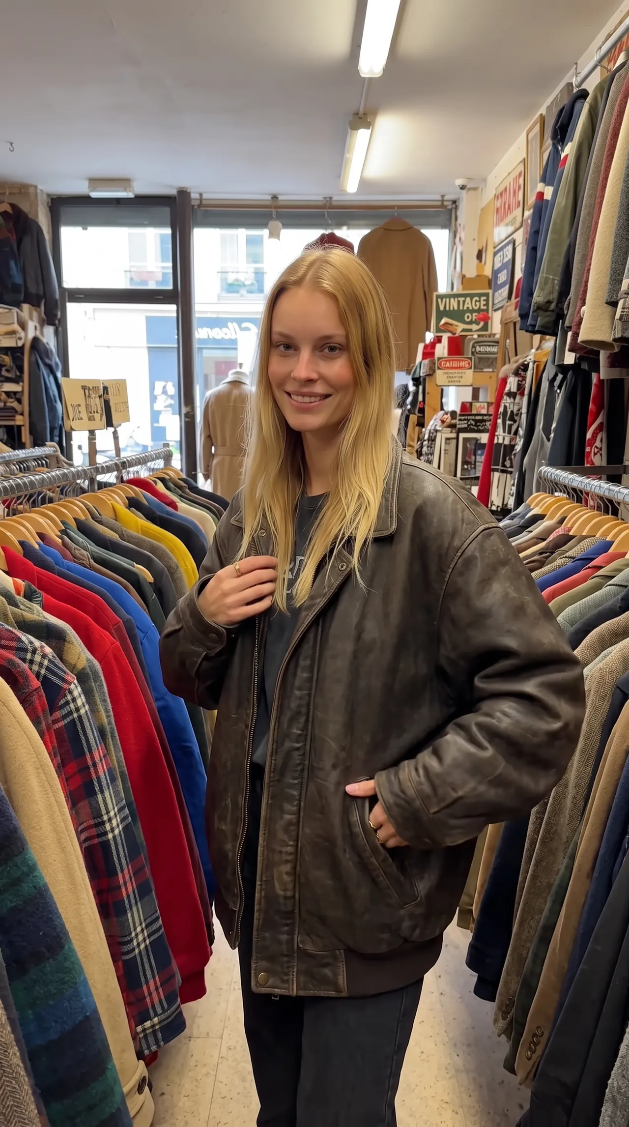 Sofia in a vintage leather jacket at a thrift shop